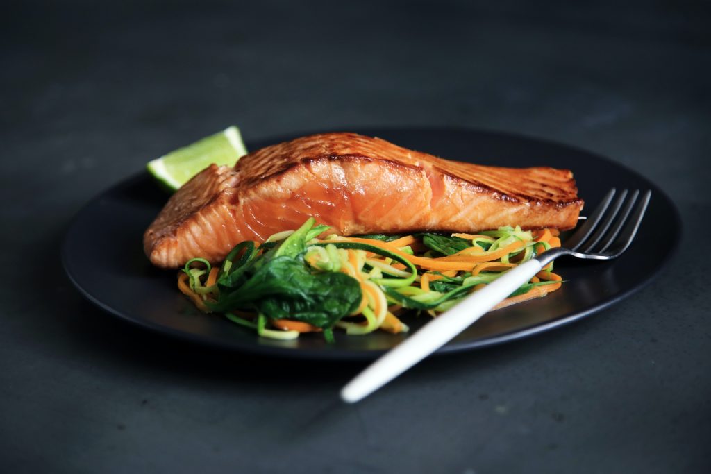 A plate of fresh salmon is shown from the menu of a restaurant's sea food night.