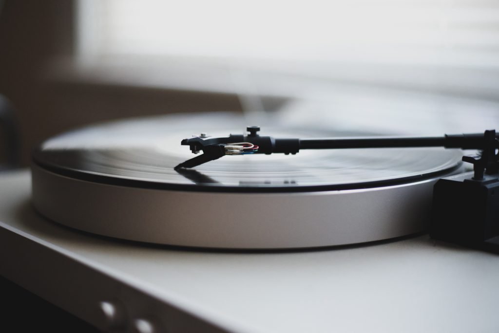 A vinyl plays on a record player.