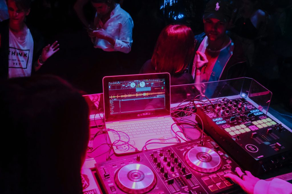 A modern DJ set-up is illuminated during a live set.