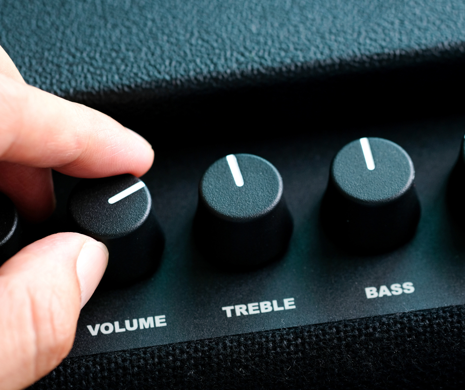 A business manager adjusts the volume for the background music playing in their establishment.