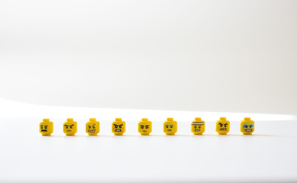 A line up of lego heads depict a range of different emotions