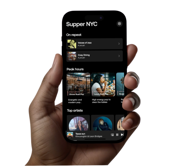 Iphone held in a hand showing the ways you can control the music from a device