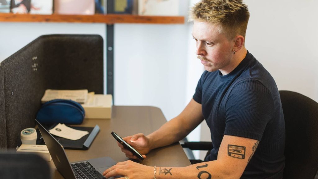 Couture Media employee working at his desk