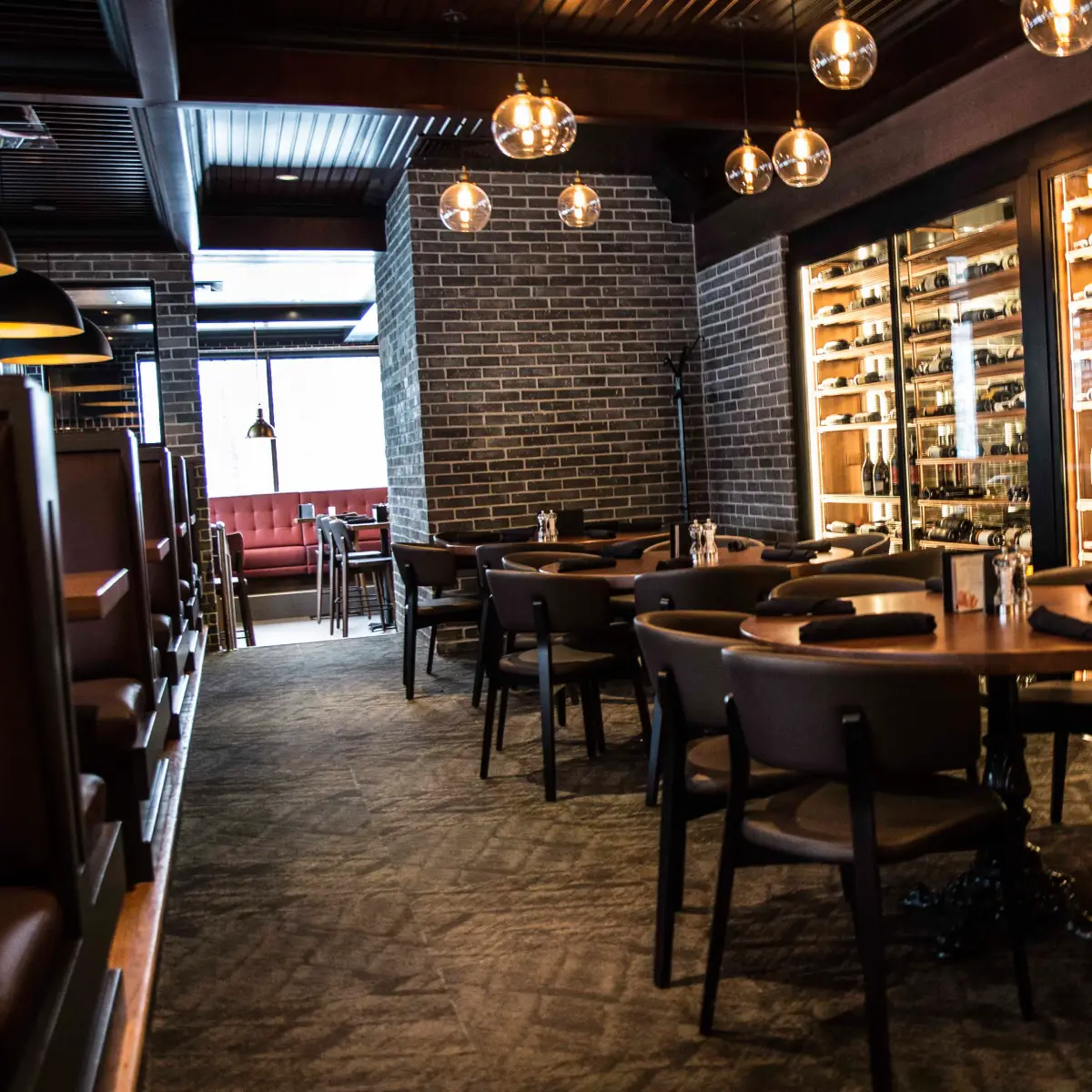 Commercial audio installation in Baton Rouge restaurant dining room with ambient lighting and multi-zone sound system